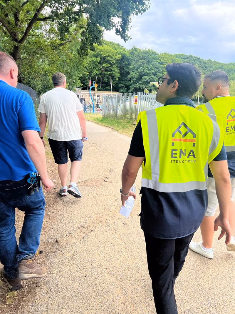 EMA Structures engineers in hi-vis vests arriving for a site inspection