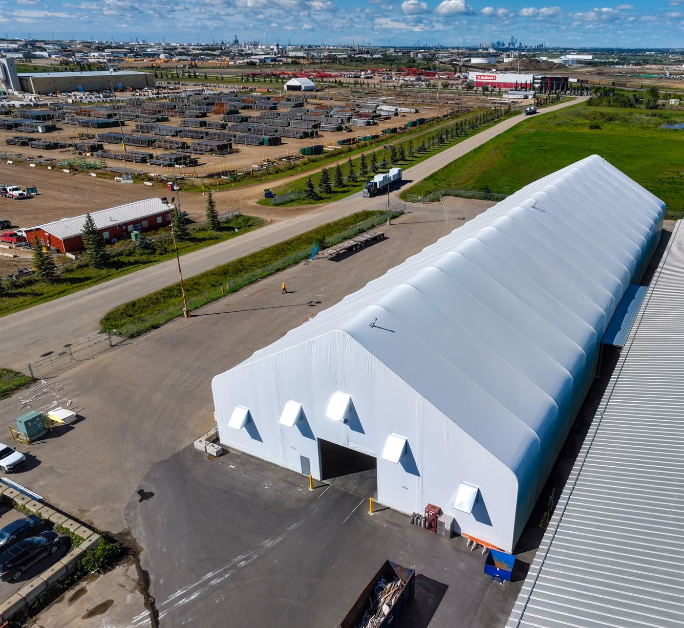 Aerial view of a white Calhoun fabric warehouse on a commercial site