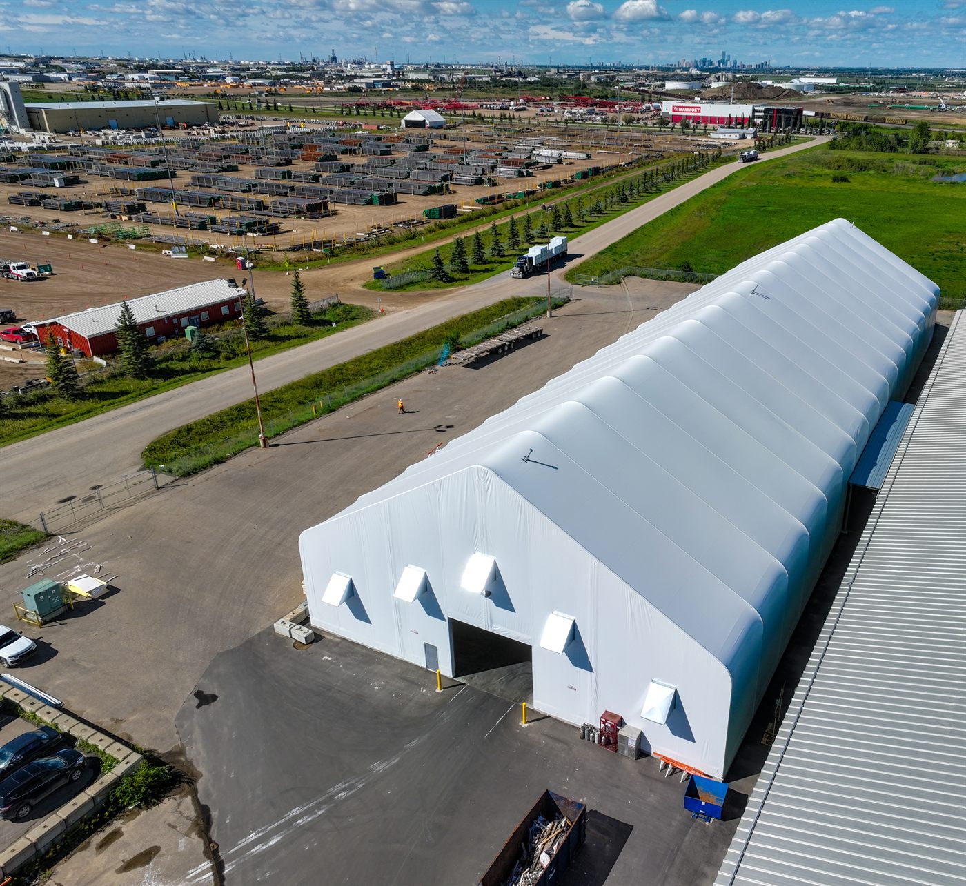 Aerial view of a white Calhoun fabric warehouse on a commercial site