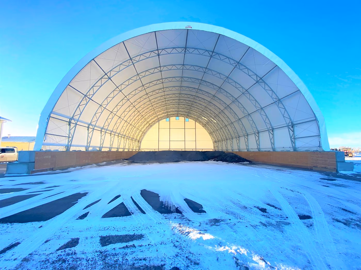 Calhoun fabric dome with concrete-block walls used for salt and sand storage