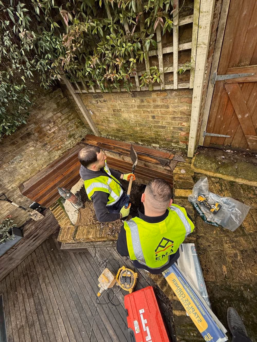 EMA site team carrying out trial pit and opening-up works in a London garden