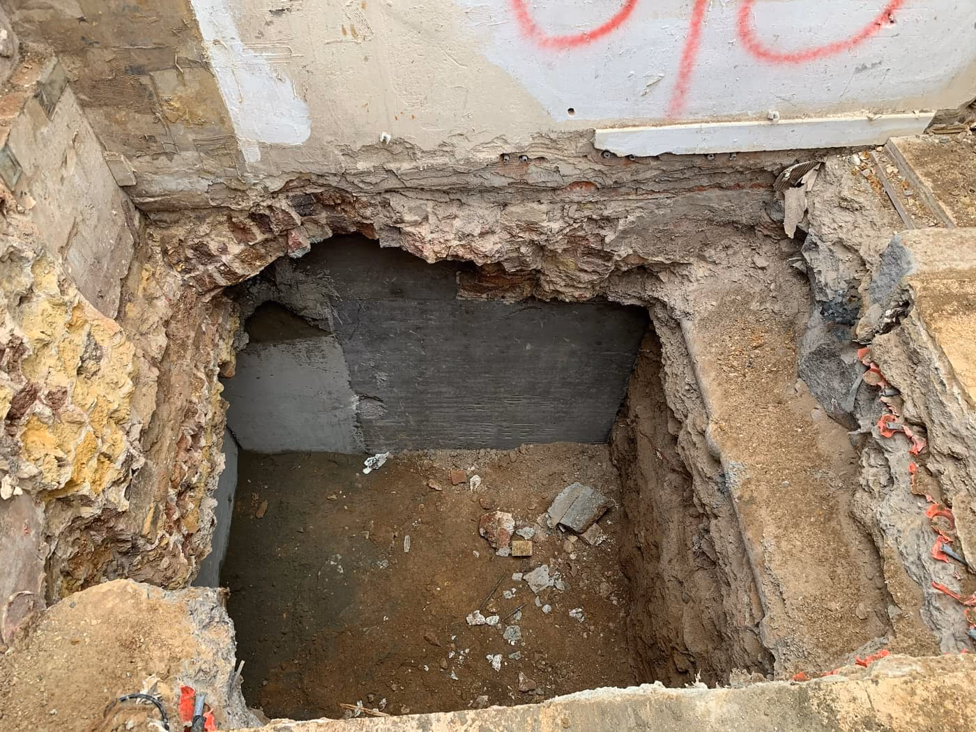 Mass concrete underpinning section cast beneath a wall in a London property